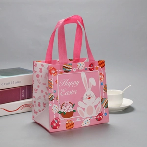 Pink Easter non-woven gift bag featuring bunny, colorful eggs, and Happy Easter text