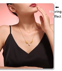 Wearing effect of golden heart zircon necklace with angel wings on a female model