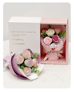 Detail of soap flower gift box with pink and white roses and gold lettering
