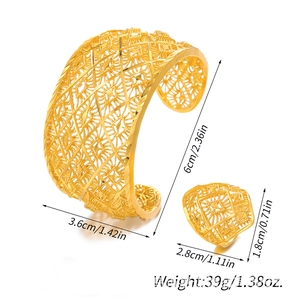 Detailed view of hollow gold cuff bracelet and ring set with precise size measurements