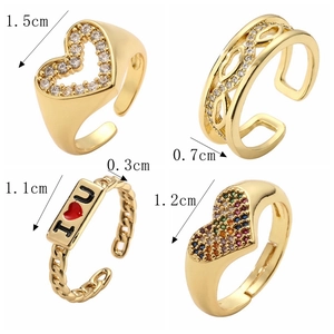 Detail view of four gold-plated open rings with zircon hearts and I LOVE U lettering