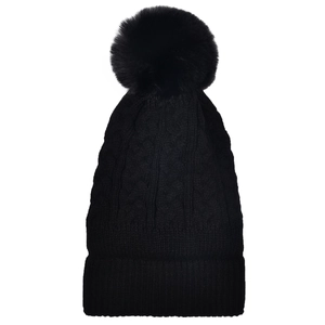 Detail view of black cable knit beanie featuring large faux fur pom-pom and ribbed cuff