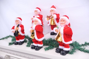 Five musical Santa figures holding golden instruments on a festive decorated surface