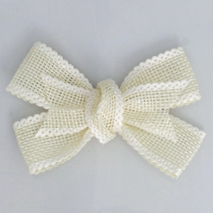 Close-up of cream-white faux linen ribbon bow with elegant wavy edges and mesh texture