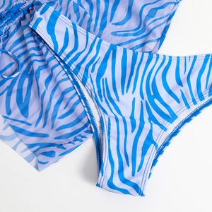Detail of blue zebra print bikini bottoms and breathable mesh cover-up with drawstring