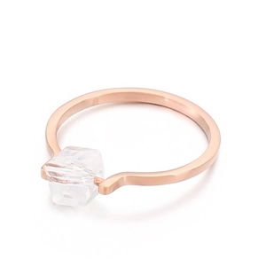 Minimalist rose gold ring with a single square zircon gemstone on a clean white background