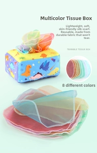 Close-up of soft baby tissue box toy with eight colorful translucent silk scarves