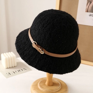 Women's black knit bucket hat with brown leather strap and heart metal pendant
