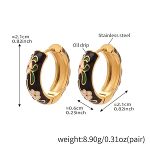 Detailed view of floral enamel pattern on 18k gold plated stainless steel earrings