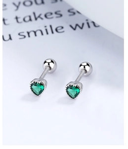Macro detail of S925 sterling silver heart-shaped green zircon studs with screw backings