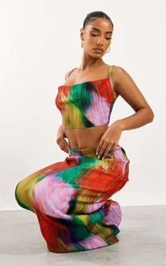 Detail of colorful pleated fabric on high-waist maxi skirt and camisole two-piece set