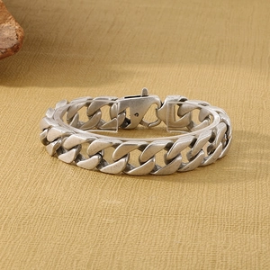 Macro detail of vintage silver-plated stainless steel curb chain bracelet with lobster clasp