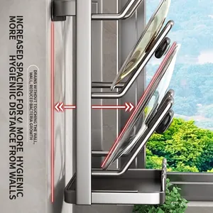 Wall-mounted dark grey pot lid rack with drip tray for kitchen organization
