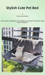 Detail view of a cat resting on a warm plush hanging balcony hammock for sunbathing