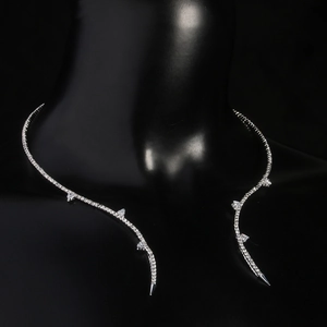 Close-up of a silver rhinestone choker necklace on a black mannequin neck with studio lighting