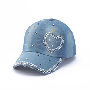 Light blue denim baseball cap featuring elegant heart pearls and metallic stud accents