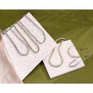 Tennis jewelry set with baguette zircon stones in gold and silver finish plating