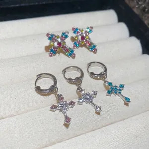 Elegant silver cross pendant earrings and X-shaped studs with colorful zircon stones