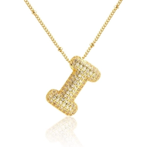 Close-up of golden bubble letter I pendant with micro-pave white cubic zirconia stones