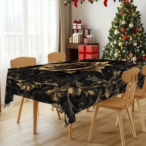 Detail of luxury black and gold tablecloth with floral European scroll patterns on a table