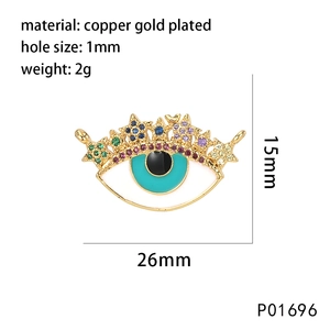 Macro view of a 26mm gold-plated evil eye charm with colorful zircon and star details