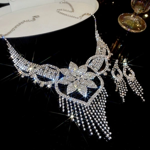 Macro shot of luxury floral necklace set with tassels and sparkling rhinestones
