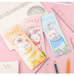 Flat lay of cute 20cm cartoon ruler sets with rabbit, cat, and bear patterns in pastels