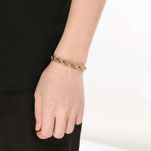 Men's fashion gold twisted rope chain bracelet in stainless steel on male model wrist