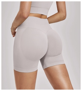 Detail showing seamless high-waist yoga shorts with push-up stitching and elastic fabric