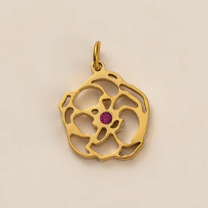 Pendentif fleur évidée en acier titane doré avec un zircon rose pierre de naissance