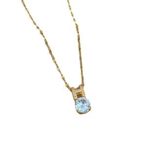 Gold plated stainless steel necklace featuring a round solitaire pendant and H-shaped clasp