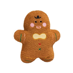 Plush gingerbread man toy made of brown textured fabric with holiday embroidery
