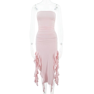 Detail of pink bodycon mini dress featuring ruched fabric and cascading ruffle hem detail
