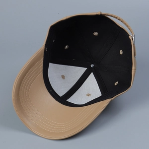 Detail view of khaki PU leather baseball cap with reinforced stitching and metal buckle