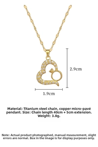 Detail view of heart pendant with sparkling white zircons and titanium steel chain