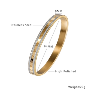 Polished 18K gold-plated titanium steel Roman numeral bangle with sparkling white zircons