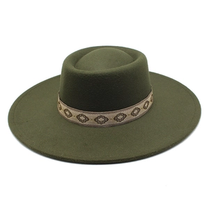 Detailed view of dark olive green wool felt fedora with ethnic embroidery hat band