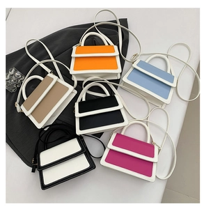 Flat lay of small crossbody bags in orange, blue, brown, black, white, and rose colors