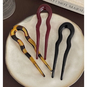 Three elegant U-shaped hair pins in tortoise shell, deep red, and black resin finish