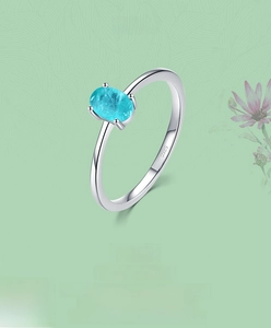 Macro shot of S925 sterling silver ring with oval light blue stone and hallmark