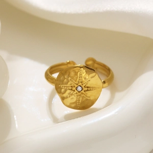 18k gold plated stainless steel open ring with an eight-pointed star and diamond accent