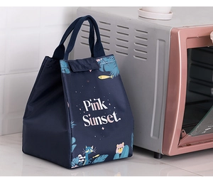 Detail view of thickened navy lunch bag with Pink Sunset print and sturdy webbing handles