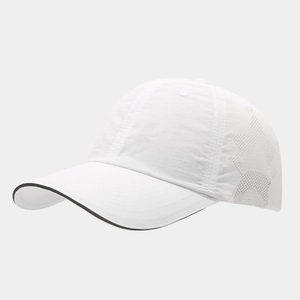 Detail of white quick-dry cap with star-shaped laser-cut vents and black piped brim