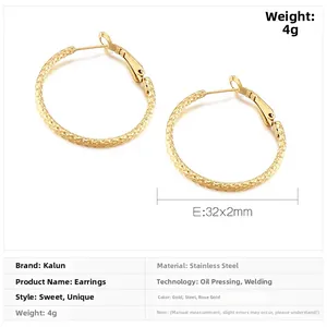 Detail view of 32mm textured gold hoop earrings with weight and size specifications