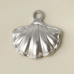 Detailed view of a silver 304 stainless steel sea shell pendant with a metallic finish