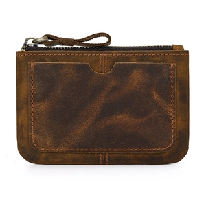 Close-up of vintage brown crazy horse leather coin purse with metal zipper and card slots