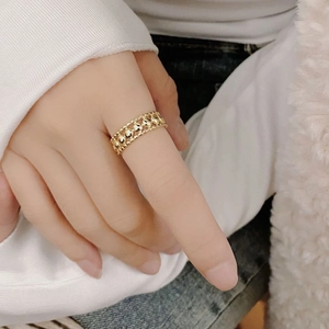 Minimalist gold S925 sterling silver hollow beaded ring worn on female finger