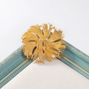 Elegant gold vintage french flower brooch pin featuring a sunburst textured design