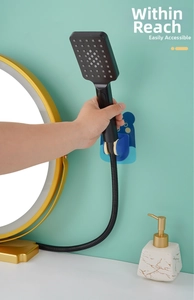 Blue cartoon bear shower head holder with adjustable angle on a bathroom wall