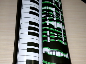 Close-up of PVC piano keyboard pattern stickers in black, white and green art designs